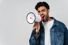 This is a photo of a man on a megaphone.